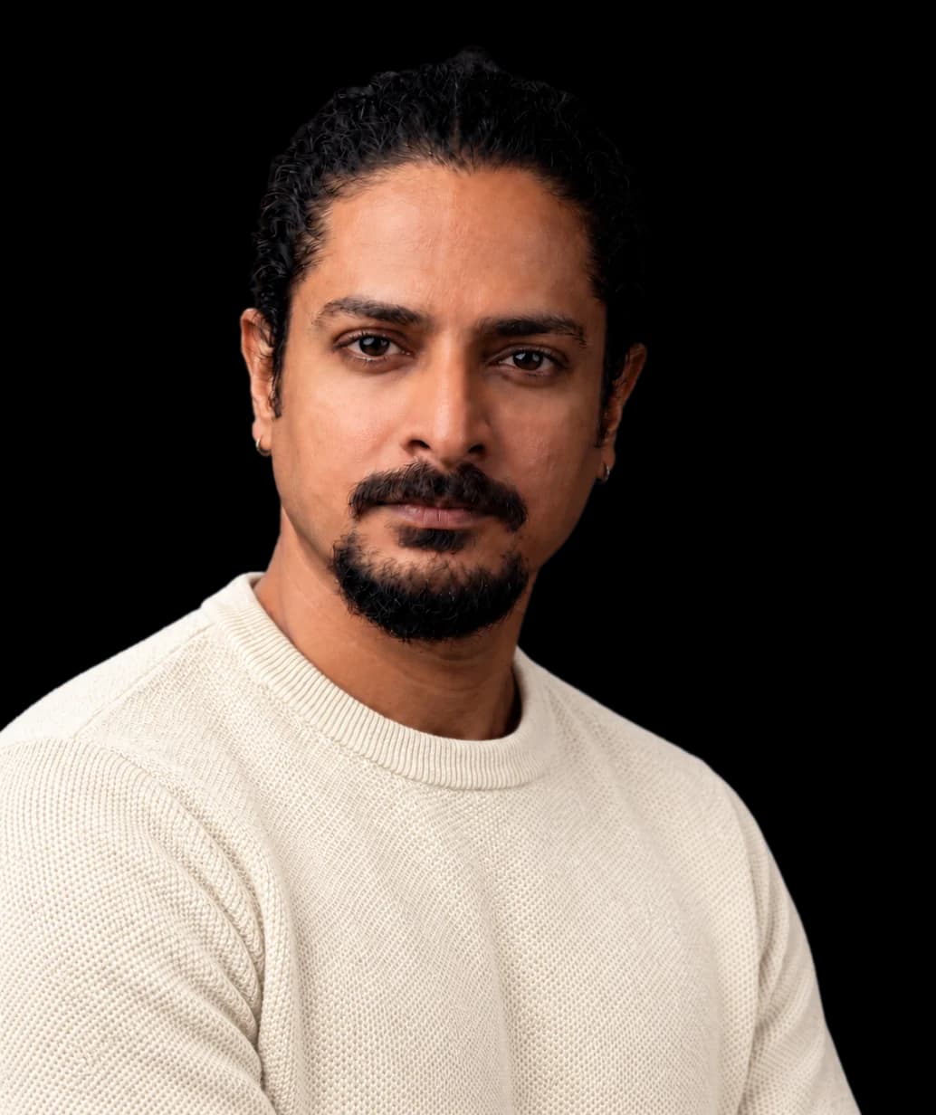 Akhilesh Bharadwaj in an ivory knit sweater