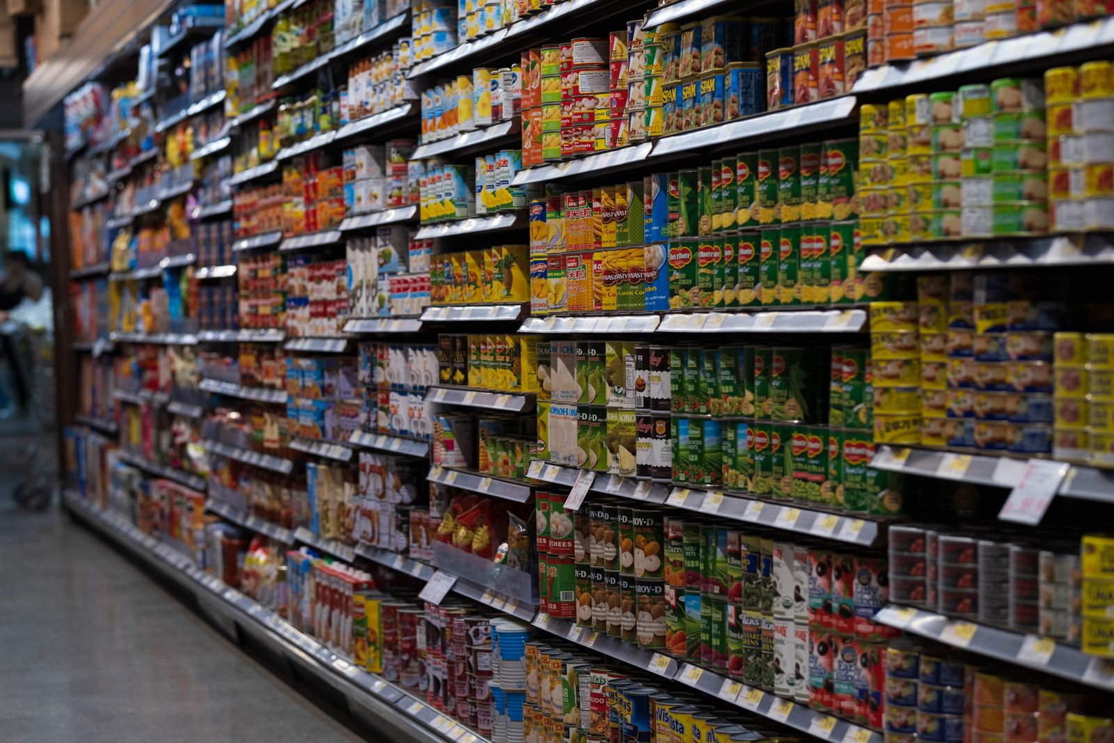 Products line a supermarket aisle, representing consumer-brand research rather than a specific Customer Shastra client.