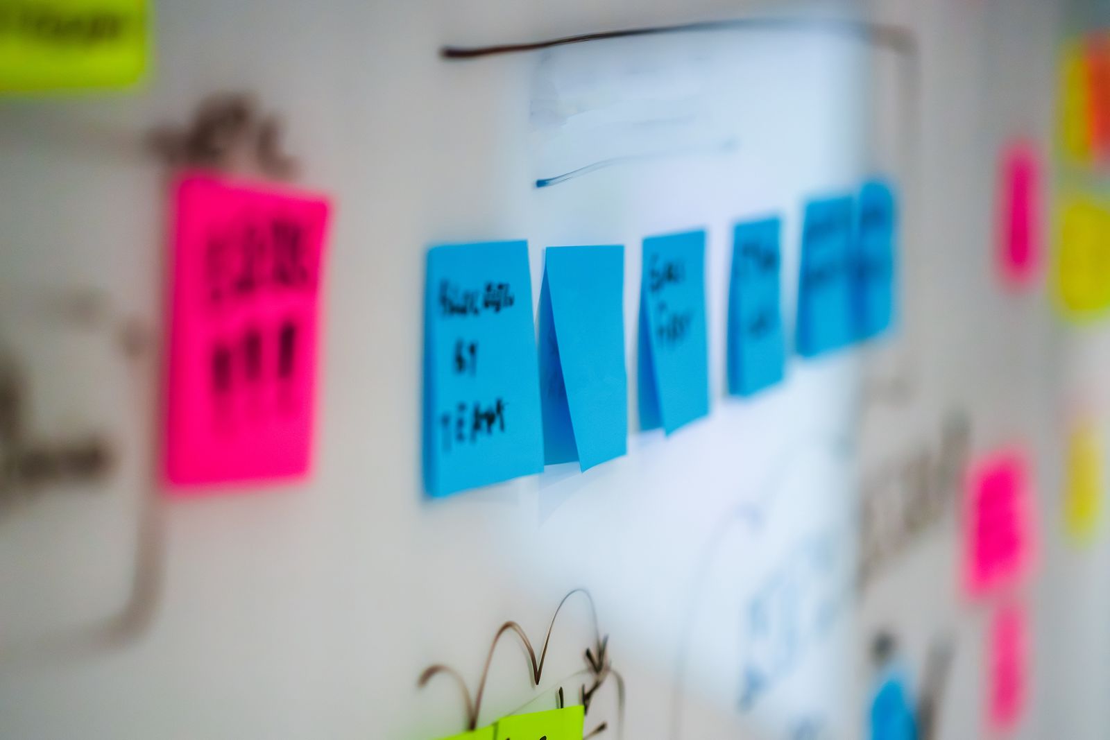 A team maps ideas on a whiteboard, illustrating the choices behind product and brand positioning.