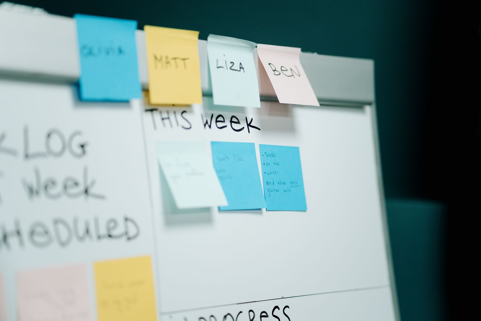 Close view of sticky notes organized across a planning board, representing customer and market research.